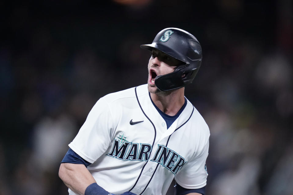 Seattle Mariners' Mitch Haniger yells as he begins to round the bases on his three-run home run against the Oakland Athletics in the fourth inning of a baseball game Monday, Sept. 27, 2021, in Seattle. (AP Photo/Elaine Thompson)