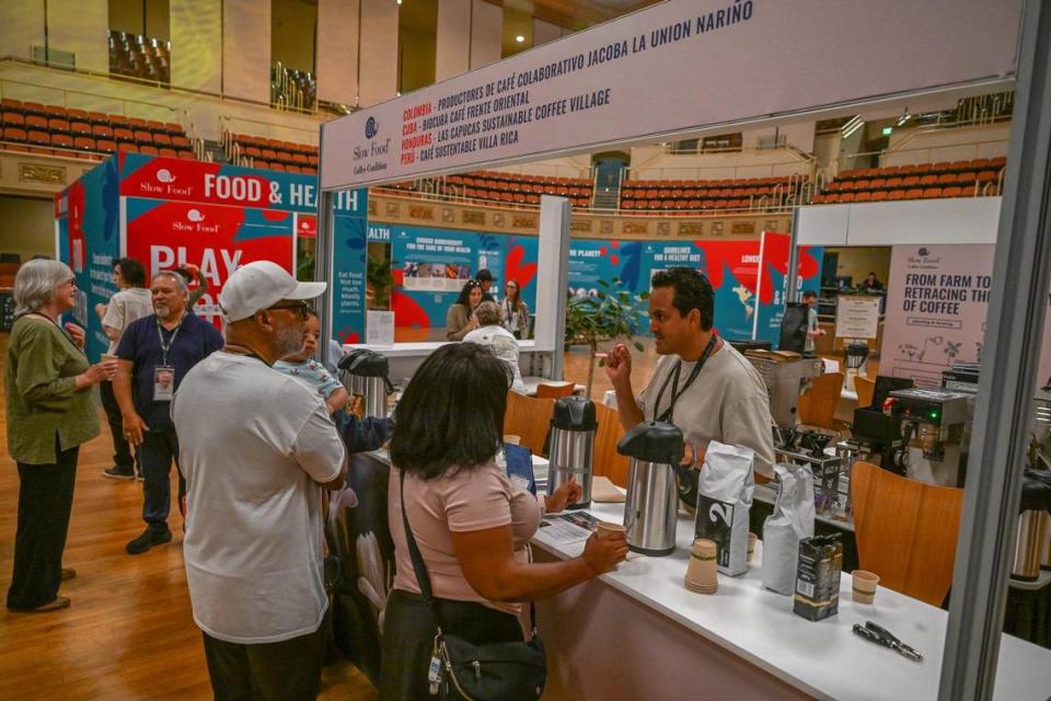 Barista Cesar Marin of Peru offers coffee during a tasting at an inaugural Terra Madre Americas event sponsored by Sow Food at the Sacramento Memorial Auditorium on Friday.