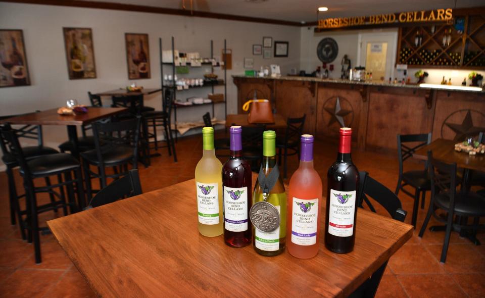 A few of the wines produced at Horseshoe Bend Cellars Vineyard and Winery on display in the tasting room.