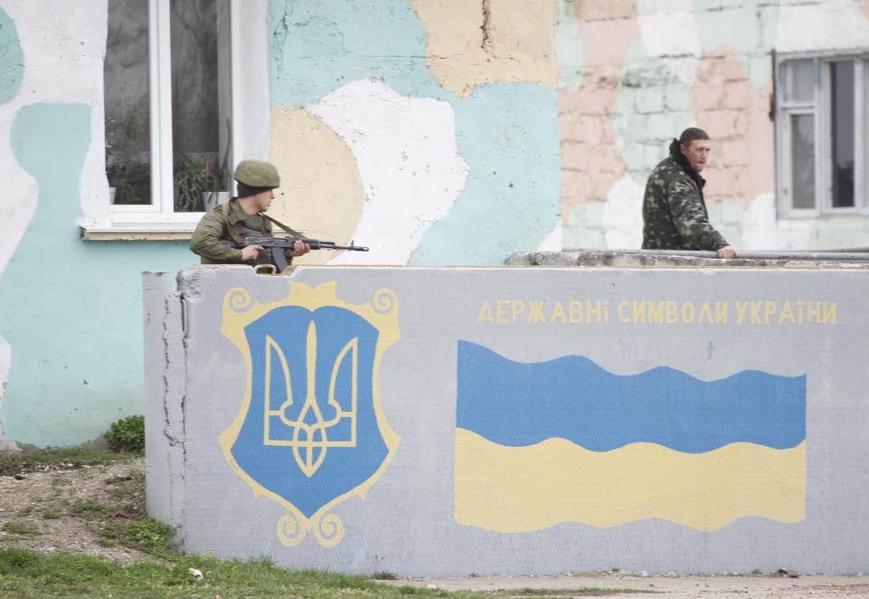 Russian servicemen guard the Belbek airport in the Crimea region