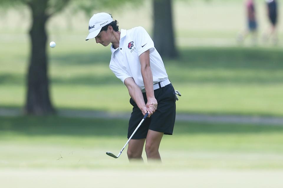 Gilbert's Ryan Lynch chips the ball from rough onto the 9th hole green during the 3A boys state golf tournament at the Veenker Memorial Golf Course Tuesday.