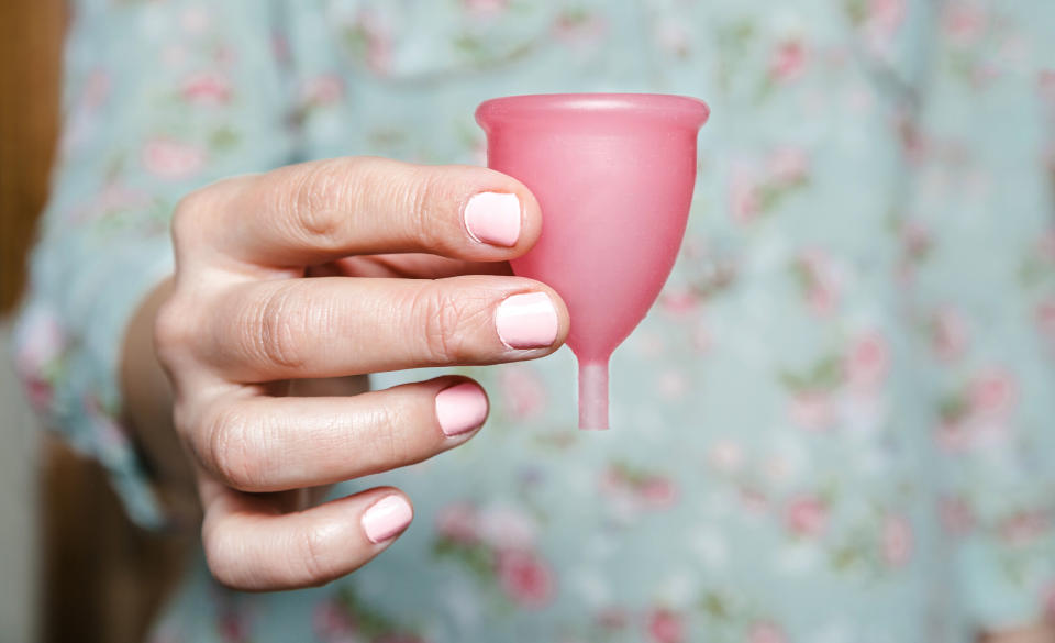 Yazmina Jade Adler uses a menstrual cup to collect her period blood [Photo: Getty]