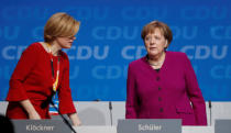 German Chancellor Angela Merkel and Julia Kloeckner during a Christian Democratic Union (CDU) party congress in Berlin, Germany, February 26, 2018. REUTERS/Hannibal Hanschke