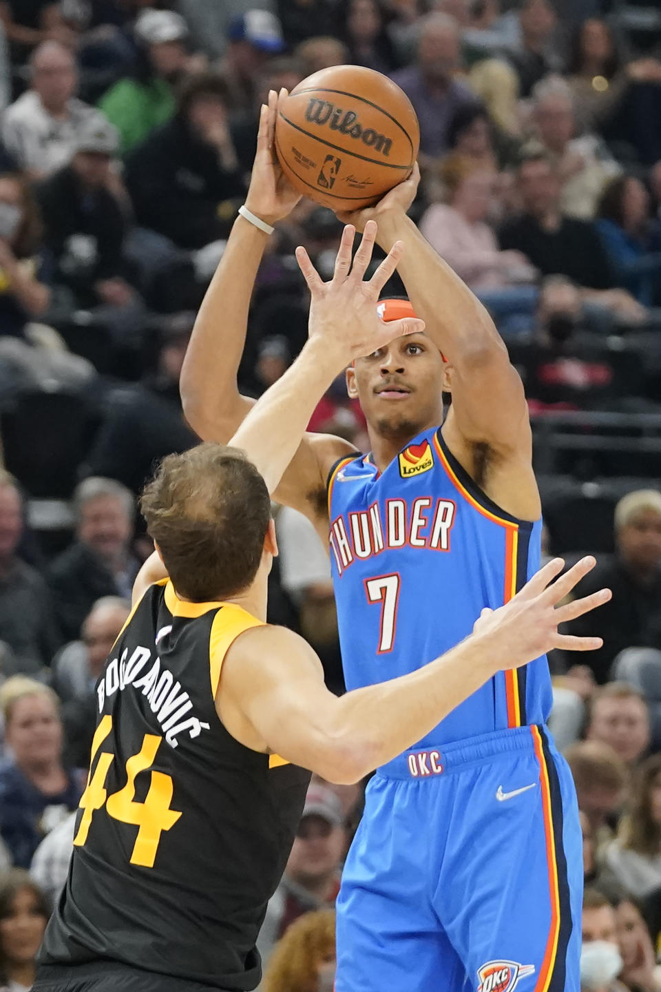 Oklahoma City Thunder forward Darius Bazley (7) shoots as Utah Jazz forward Bojan Bogdanovic (44) defends in the first half during an NBA basketball game Wednesday, Oct. 20, 2021, in Salt Lake City. (AP Photo/Rick Bowmer)