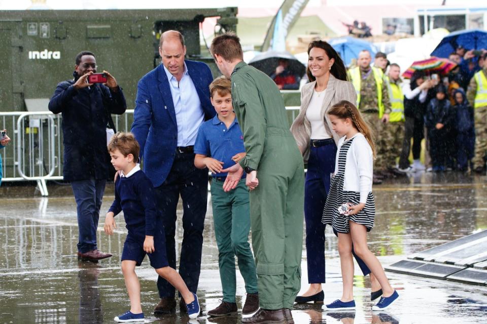 The Prince and Princess of Wales visit the Royal International Air Tattoo with their children (PA)