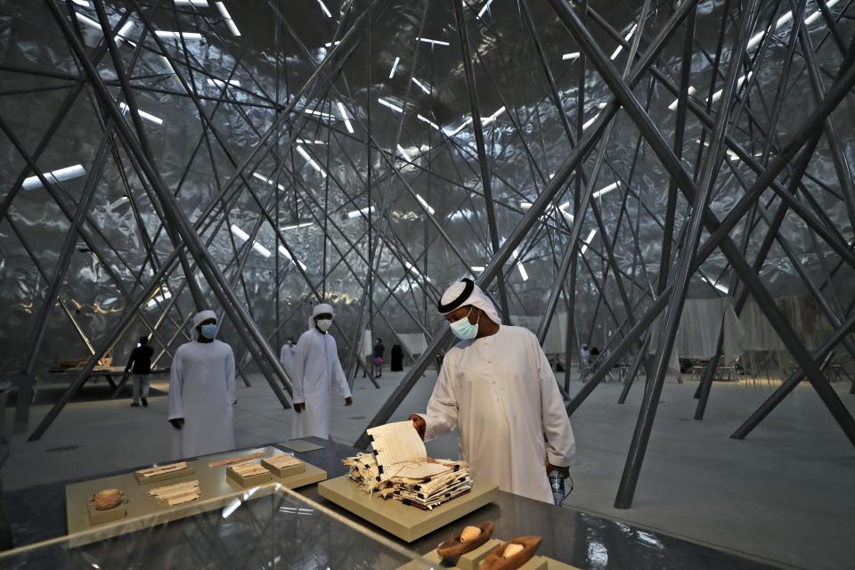 People visit the Bahrain pavilion at the Dubai Expo 2020, in Dubai, United Arab Emirates, Sunday, Oct. 3, 2021. (AP Photo/Kamran Jebreili)