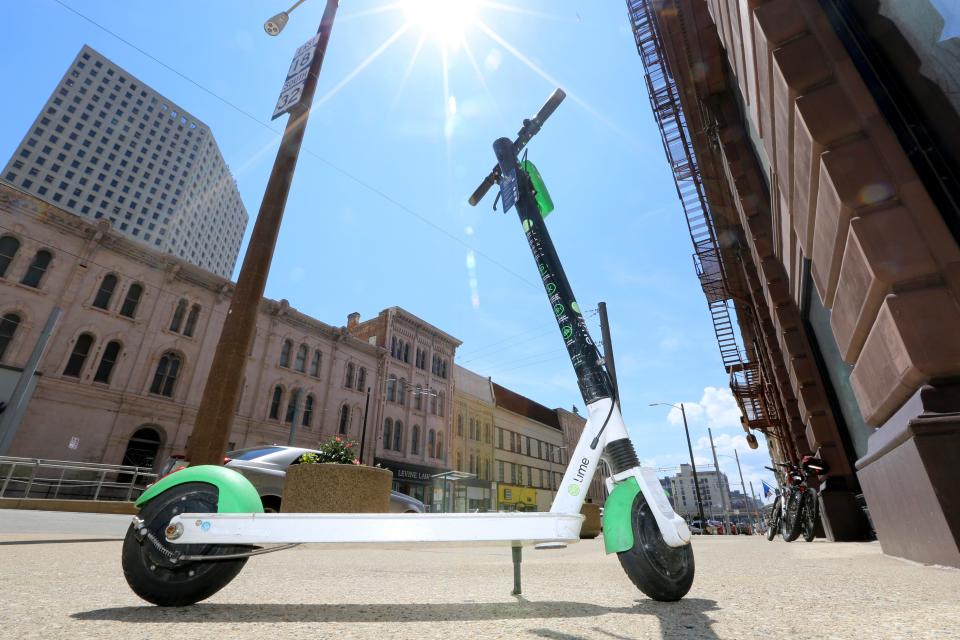 A Lime scooter sits at the corner of East Wisconsin Street and North Milwaukee Street in Milwaukee on Tuesday, June 1, 2021. - Photo by Mike De Sisti / Milwaukee Journal Sentinel via USA TODAY NETWORK