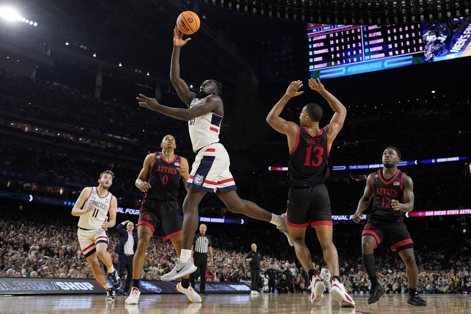 Connecticut forward Adama Sanogo scores during the second half of the men's national championship college basketball game against San Diego State in the NCAA Tournament on Monday, April 3, 2023, in Houston. (AP Photo/David J. Phillip)