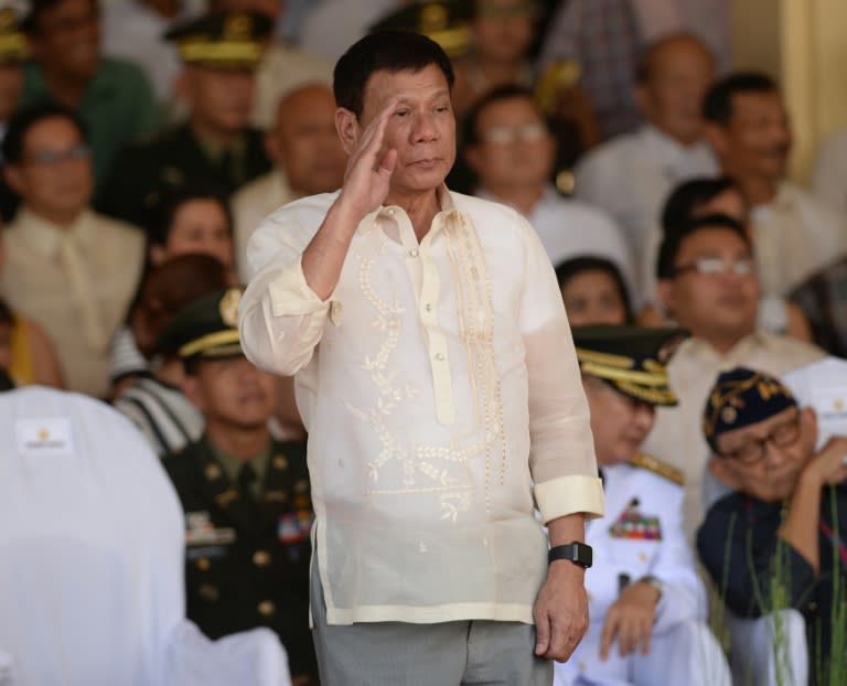 Philippines President Rodrigo Duterte salutes during a military parade and change of command ceremony, at the military headquarters in Manila, on July 1, 2016