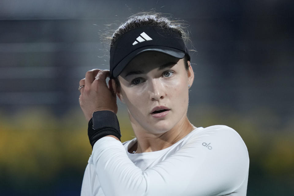 Anna Kalinskaya gestures after lost the second set against Jasmine Paolini of Italy during the final match of the Dubai Duty Free Tennis Championships in Dubai, United Arab Emirates, Saturday, Feb. 24, 2024. (AP Photo/Kamran Jebreili)