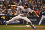 Oct 12, 2018; Milwaukee, WI, USA; Los Angeles Dodgers starting pitcher Clayton Kershaw (22) delivers a pitch during the first inning against the Milwaukee Brewers in game one of the 2018 NLCS playoff baseball series at Miller Park. Mandatory Credit: Benny Sieu-USA TODAY Sports