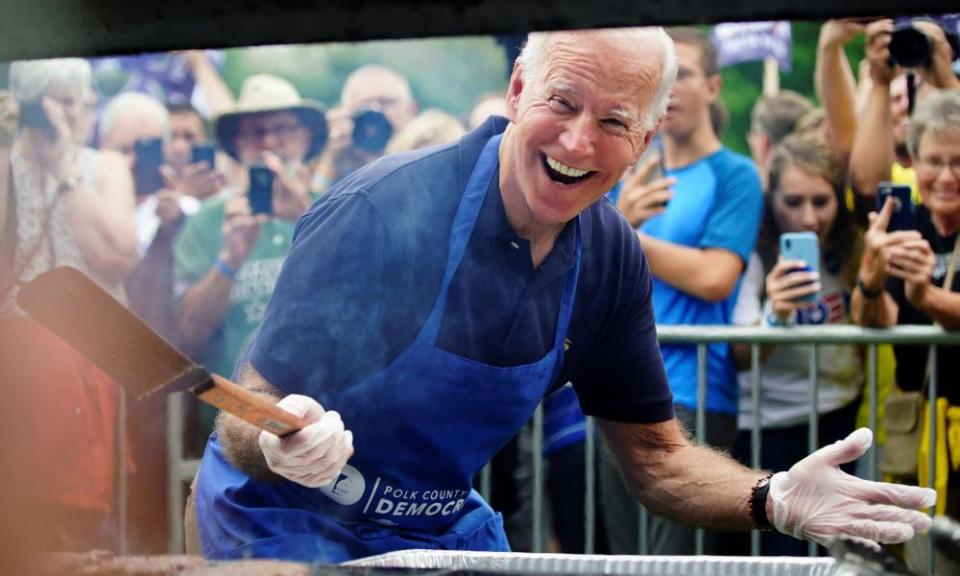 Joe Biden smiles for the media while frying steaks at the Polk County Democrats’ Steak Fry in Des Moines, Iowa on Saturday.