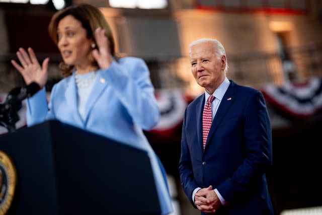 <p>Andrew Harnik/Getty</p> Joe Biden watches Kamala Harris speak at a May 2024 campaign rally in Philadelphia