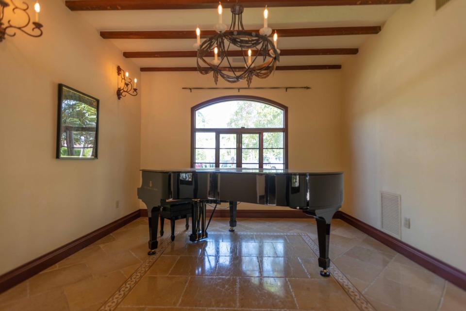 6) Rustic stone floors, mahogany windows, and mosaic tile are featured throughout the property.