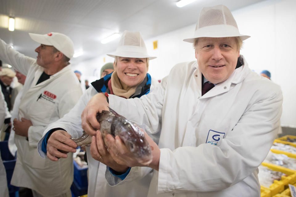 Prime Minister Boris Johnson during a visit to Grimsby Fish Market, while on the General Election campaign trail. PA Photo. Picture date: Monday December 9, 2019. See PA story POLITICS Election. Photo credit should read: Stefan Rousseau/PA Wire