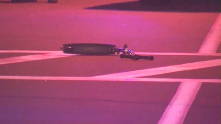 The victim's scooter is seen on the ground after a double-fatal crash in Westlake Village on Sept. 29, 2020. (KTLA)