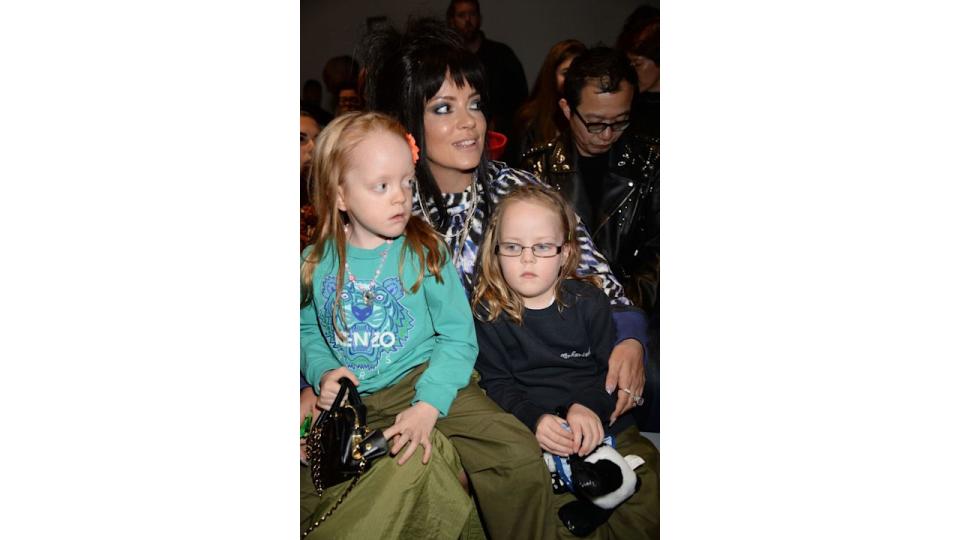 Lily Allen with her daughters on her knee