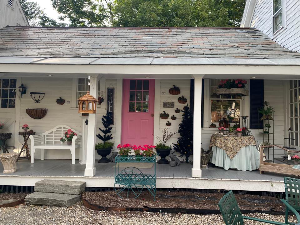 highly decorated porch of a boutique in lauren's vermont town