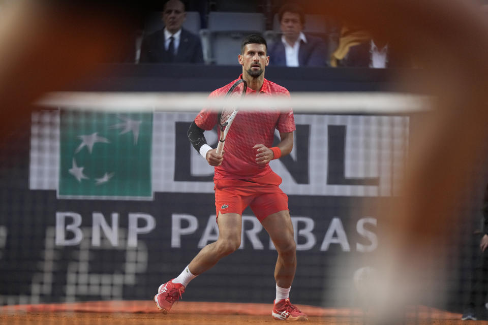 Serbia's Novak Djokovic returns the ball to Argentina's Tomas Etcheverry during their match at the Italian Open tennis tournament, in Rome, Friday, May 12, 2023. (AP Photo/Andrew Medichini)