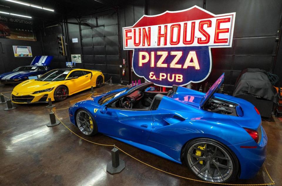 The Fun House Pizza & Pub sign towers over exotic cars at the Kansas City Automotive Museum in Olathe but will be moved to Pennway Point. The sign was in Raytown for 53 years until 2017, when it was donated to Lumi by Anna and Gary Graham, the son of the restaurant’s former owner.