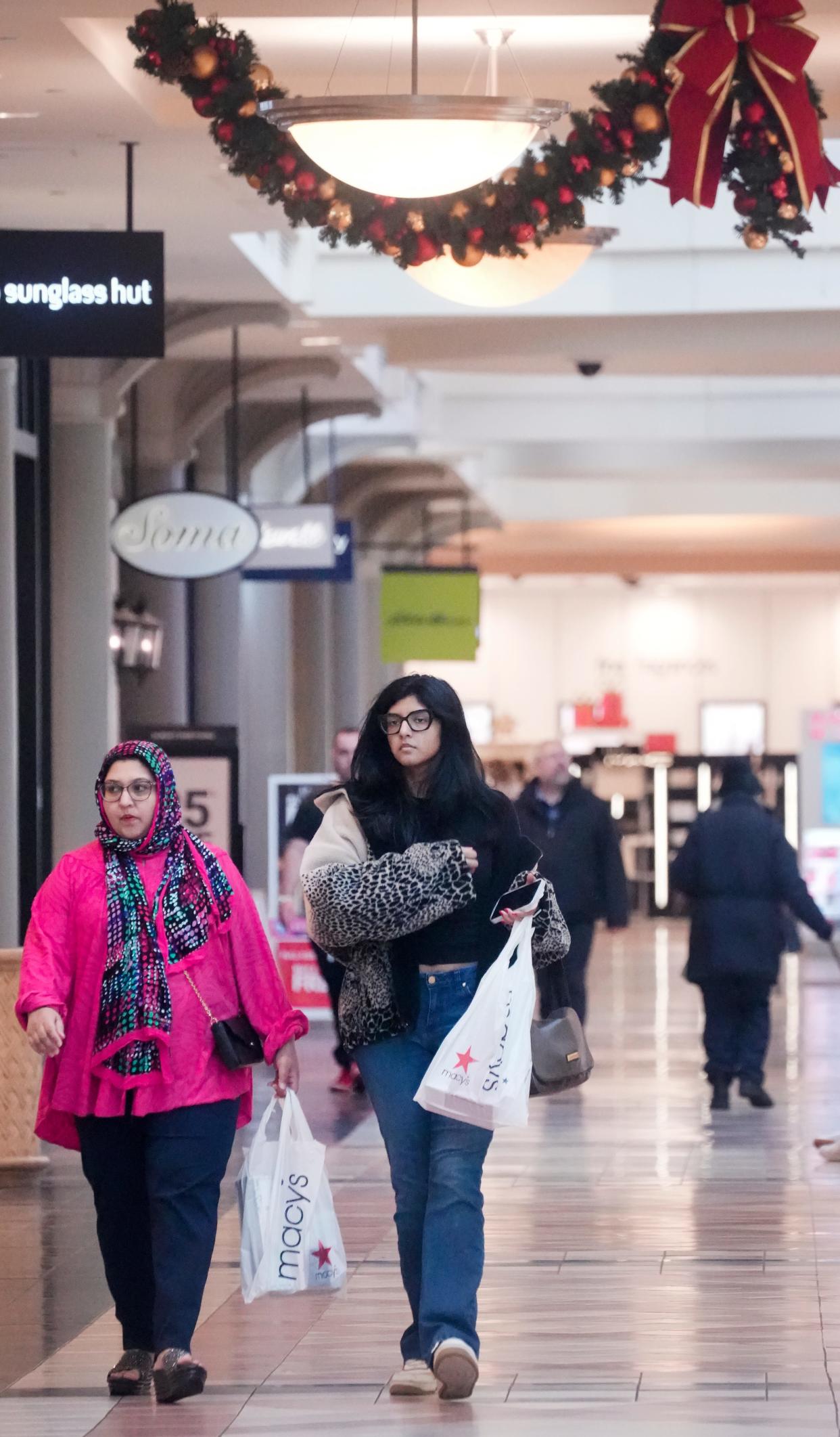 Shoppers walk around Mayfair Mall in Wauwatosa.