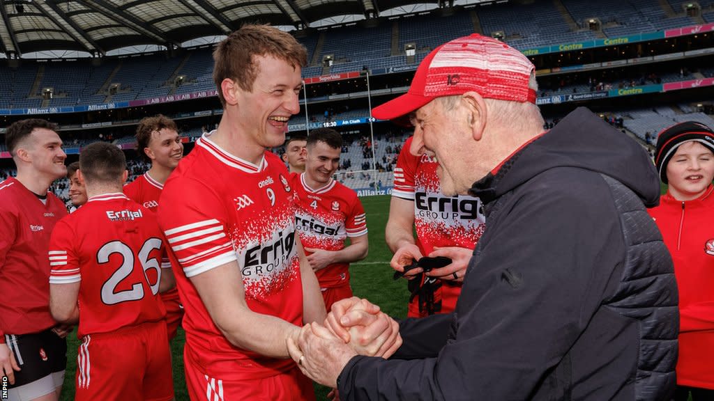 Derry's Brendan Rodgers celebrates with manager Mickey Harte after the Division One final win over Dublin