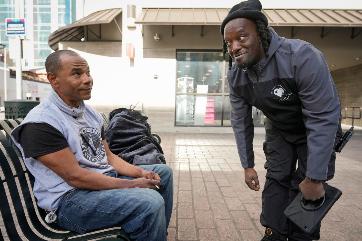 L.D. Davis visits with Adrian Hobbs, who is experiencing homelessness. Familiarity is a valuable commodity in homeless outreach, and it comes easily to Davis, who grew up in Austin.