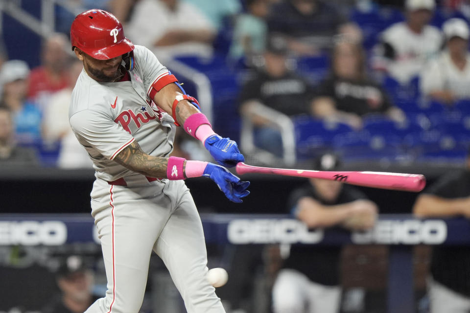 Philadelphia Phillies' Edmundo Sosa loses his bat as he hits during the first inning of a baseball game against the Miami Marlins, Sunday, May 12, 2024, in Miami. (AP Photo/Wilfredo Lee)