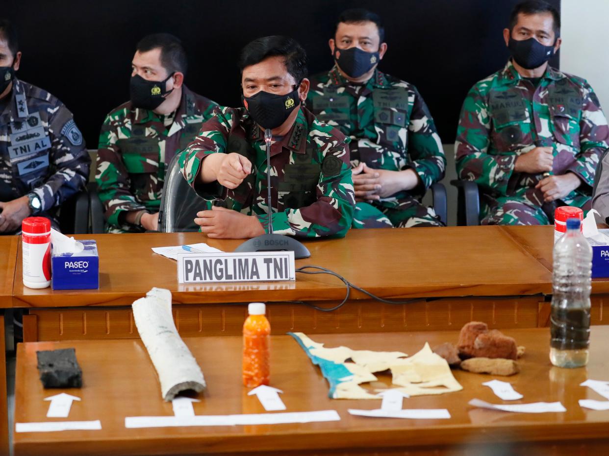 Indonesian military Chief Hadi Tjahjanto displays debris believed to be from missing Indonesian Navy submarine KRI Nanggala (EPA)