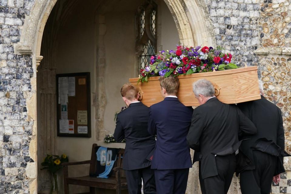 Pallbearers carry the coffin of TV presenter and journalist Bill Turnbull (Joe Giddens/PA) (PA Wire)