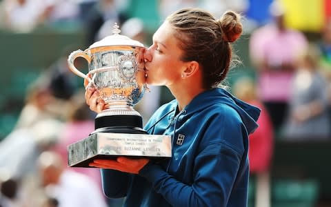  Simona Halep of Romania poses with the trophy after her Women's Singles Final match against Sloane Stephens - Credit: Getty images