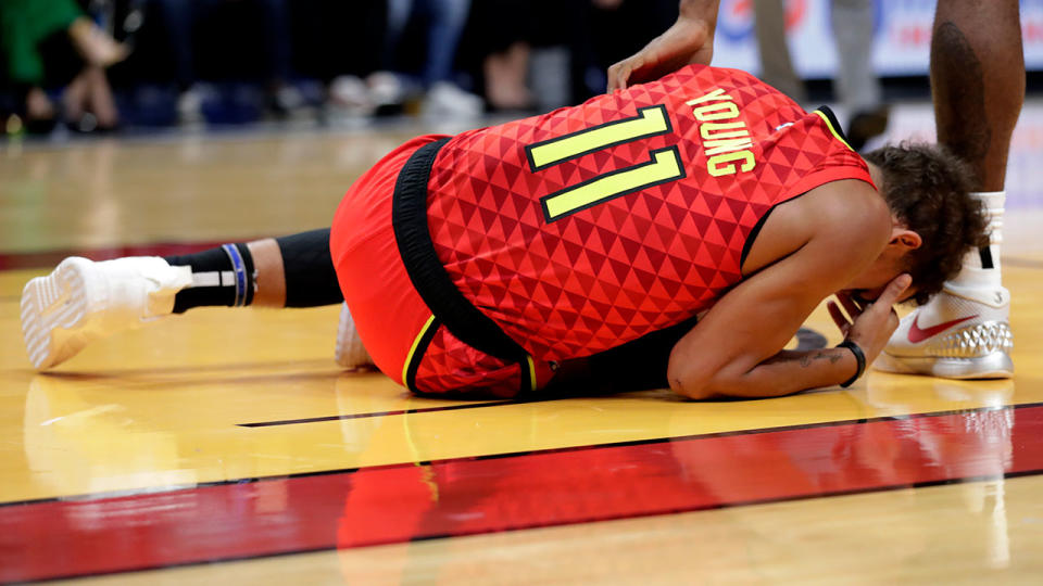 Hawks guard Trae Young was in obvious pain after twisting his ankle against the Heat. 