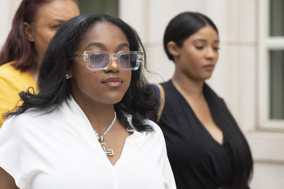 Azriel Clary, left, and Joycelyn Savage, right, two women who lived in Chicago with R&B singer R. Kelly, leave Brooklyn federal court following his arraignment, Friday, Aug. 2, 2019 in New York. Kelly pleaded not guilty Friday to federal charges he sexually abused women and girls. The 52-year-old Kelly was denied bail in a Brooklyn courtroom packed with his supporters. . (AP Photo/Mark Lennihan)