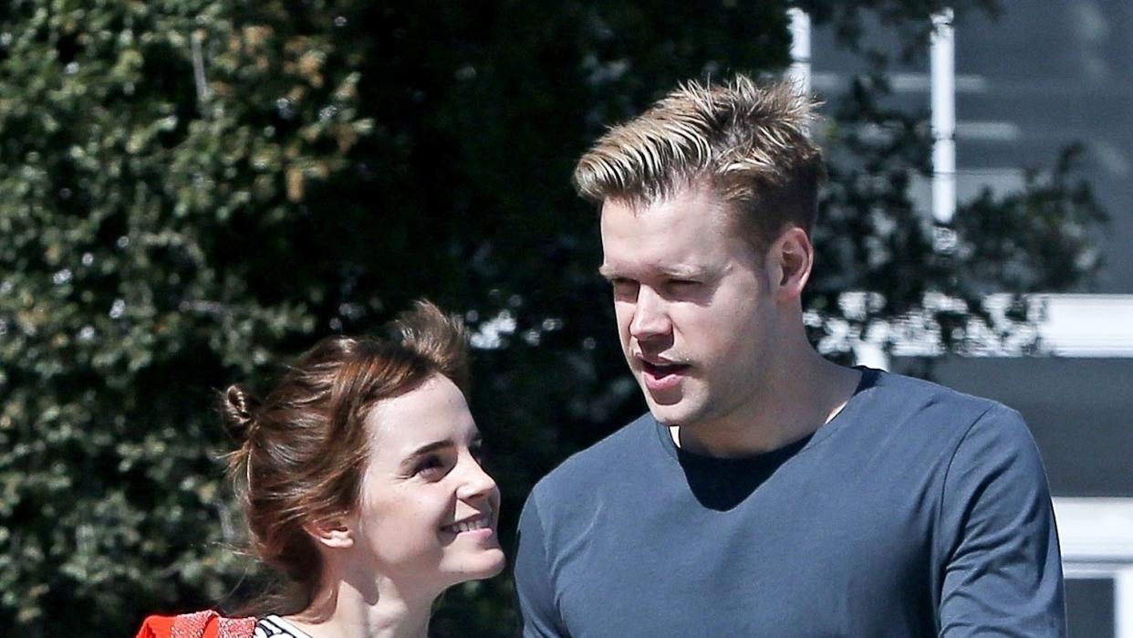 emma watson and chord overstreet holding hands and smiling
