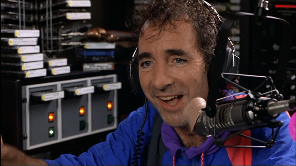 <p>Harry Shearer’s douchebag DJ makes for a terrible host when he’s interviewing Wayne and Garth about WayneStock. As the conversation continues, it becomes clear he’s not listening to a word they’re saying and is just responding with random “Mm-hmms” and “Uh-huhs”. Wayne responds: “I could say anything to you now, like ‘You’re a complete tool’.” Uh-huh.(Credit: Paramount Pictures) </p>