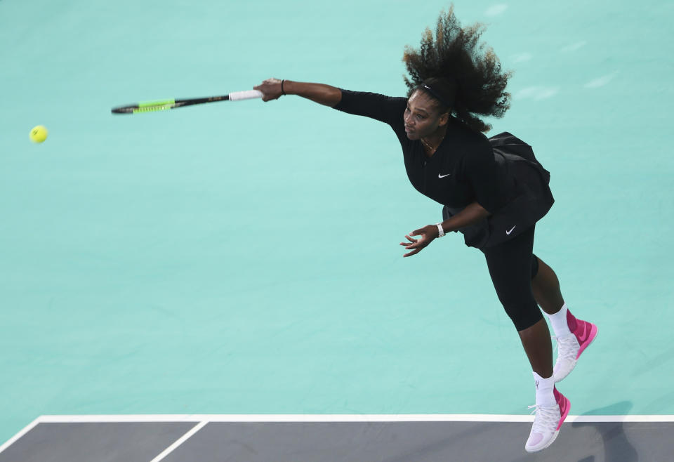 Serena Williams serves to Jelena Ostapenko during the final day of the Mubadala World Tennis Championship in Abu Dhabi. (AP Photo)