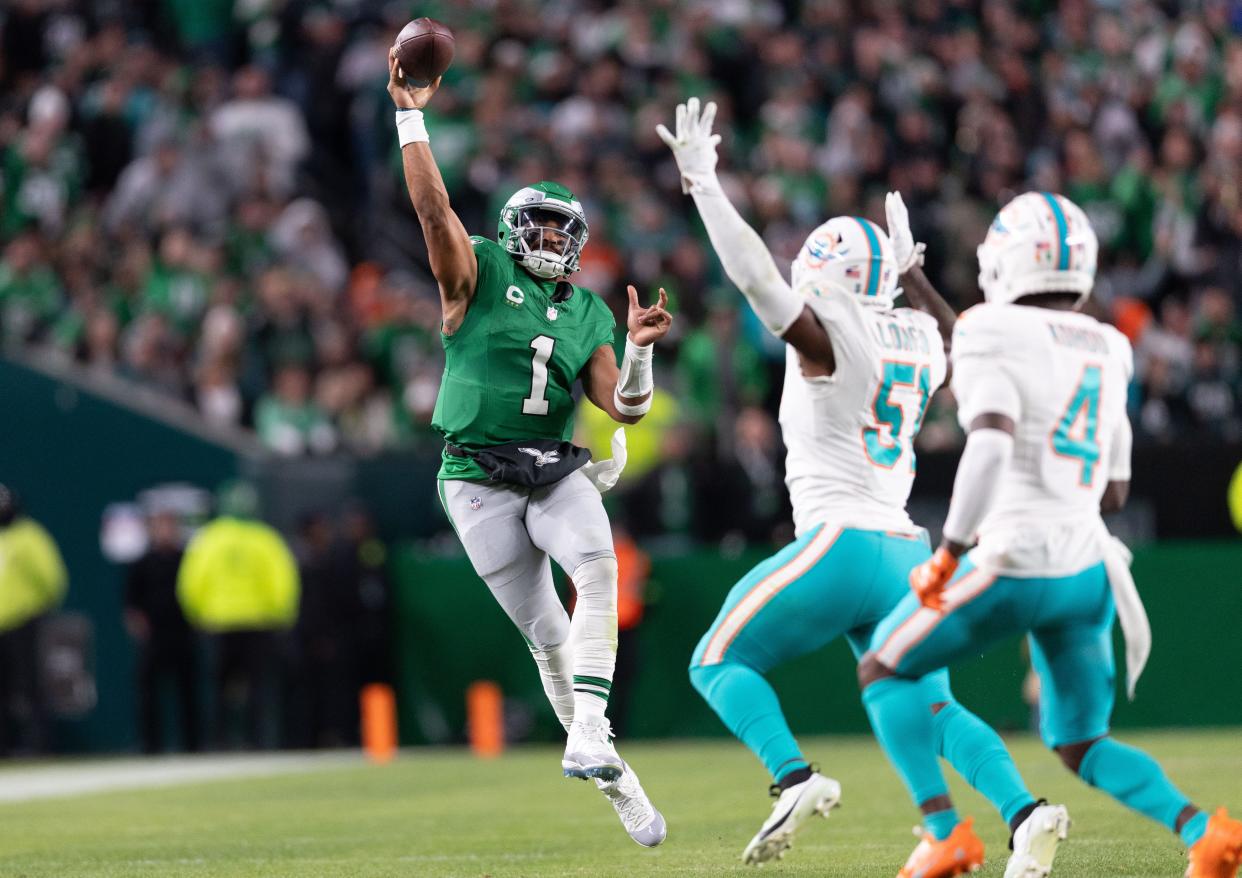 Oct 22, 2023; Philadelphia, Pennsylvania, USA; Philadelphia Eagles quarterback Jalen Hurts (1) passes the ball past Miami Dolphins linebacker David Long Jr. (51) during the second quarter at Lincoln Financial Field. Mandatory Credit: Bill Streicher-USA TODAY Sports