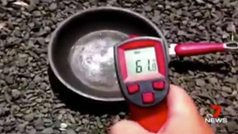 The moment the man whips out the temperature gauge to prove just how hot it is. Source: 7 News