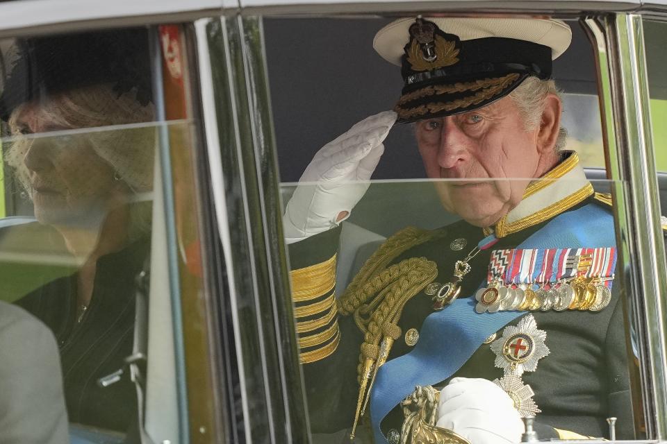 FILE - King Charles III salutes as he leaves Westminster Abbey following the state funeral service of Queen Elizabeth II in Westminster Abbey in central London Monday Sept. 19, 2022.  King Charles III faces the task of preserving a 1,000-year-old monarchy that his mother nurtured for seven decades but that faces an uncertain future. The challenge is immense. (AP Photo/Martin Meissner, Pool, File)