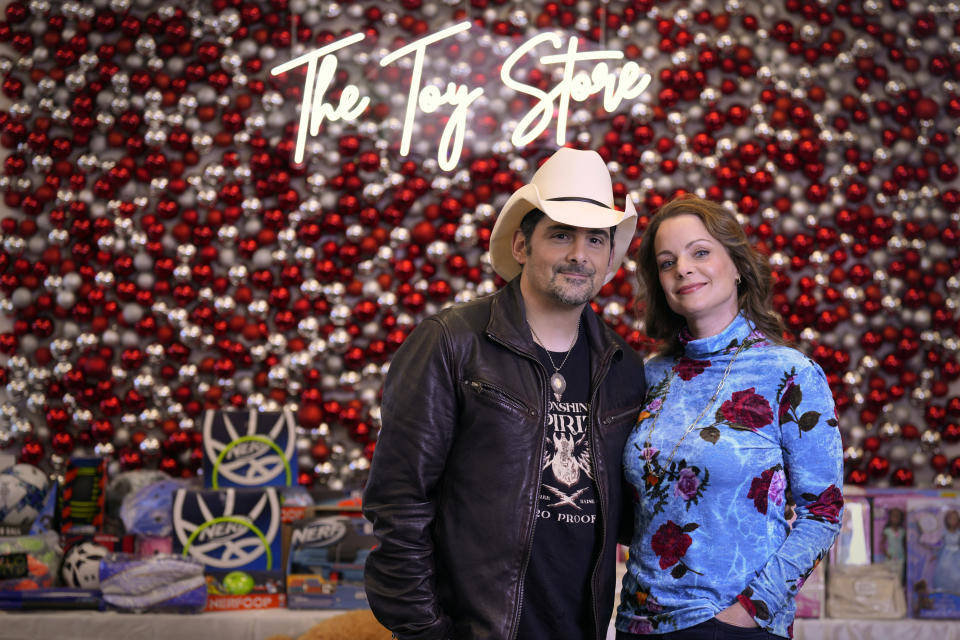 Brad Paisley, left, and Kimberly Williams-Paisley pose for a picture at The Toy Store, a free-referral based toy store Thursday, Dec. 7, 2023, in Nashville, Tenn. The couple co-founded the facility, and they also also started The Store, a free-referral based grocery store they opened in partnership with Belmont University in March 2020. (AP Photo/Mark Humphrey)