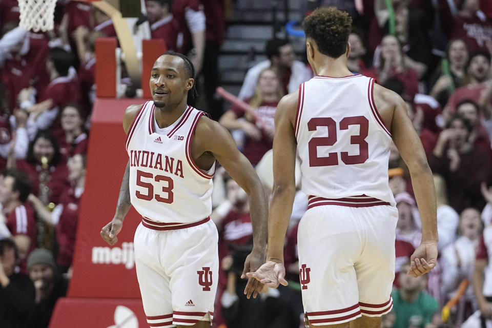 Indiana's Tamar Bates (53) and Trayce Jackson-Davis (23) react during the second half of an NCAA college basketball game against Michigan State, Sunday, Jan. 22, 2023, in Bloomington, Ind. (AP Photo/Darron Cummings)