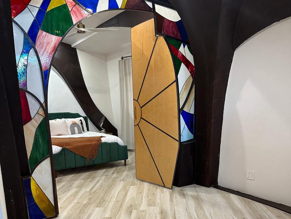Entrance to bedroom with a stained-glass archway