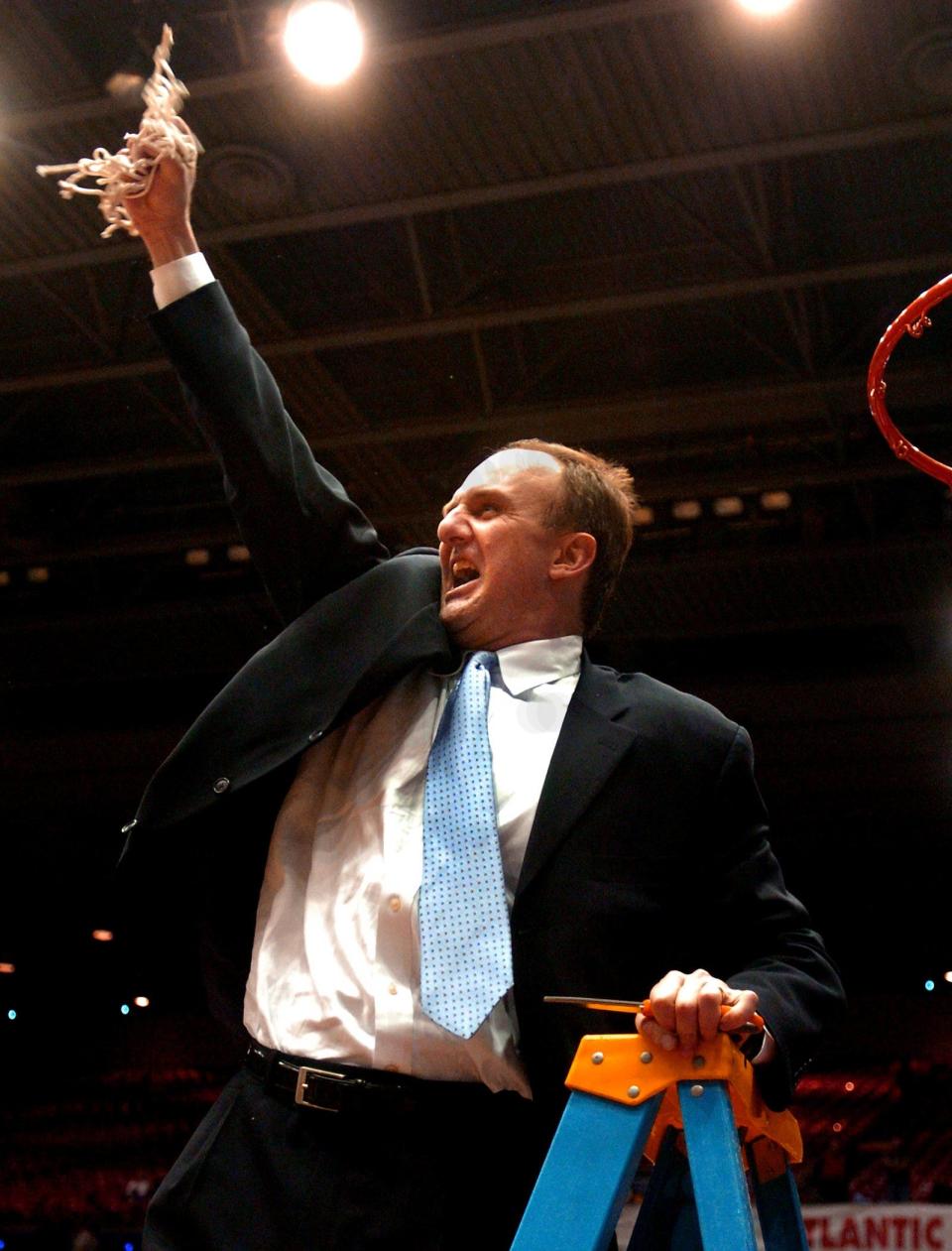 2004.0313.10.1--XAVIER WINS A10--Xavier coach Thad Matta celebrates the A-10 victory over Dayton Saturday, March 13, 2004, at the UD Arena. Photo hby CRaig Ruttle/Cincinnati Enquirer