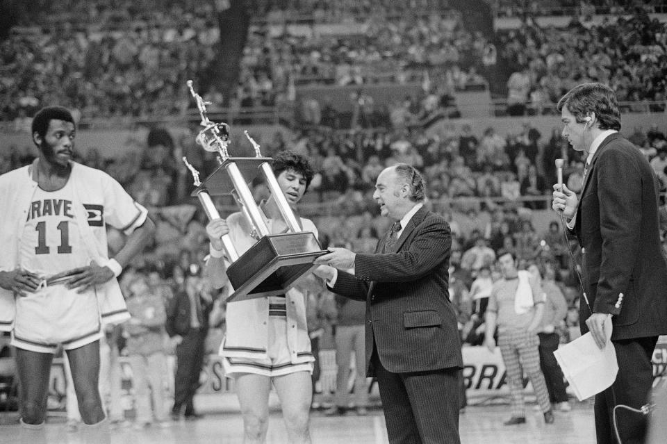 From left, Buffalo Braves stars Bob McAdoo and Ernie DiGregorio receive awards from NBA commissioner Walter Kennedy on April 6, 1974.