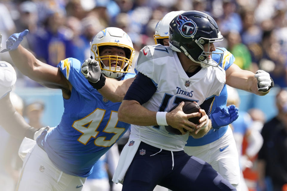 Tennessee Titans quarterback Ryan Tannehill is sacked by Los Angeles Chargers linebacker Joey Bosa, right, during the first half of an NFL football game Sunday, Sept. 17, 2023, in Nashville, Tenn. (AP Photo/George Walker IV)