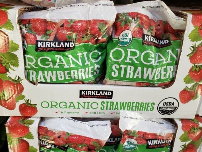 Bags of frozen strawberries in red and white boxes at Costco