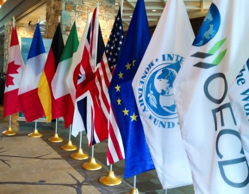 Flags line the entrance of the Fairmont Hotel in the Canadian town of Whistler as it hosts G7 ministerial meeting events