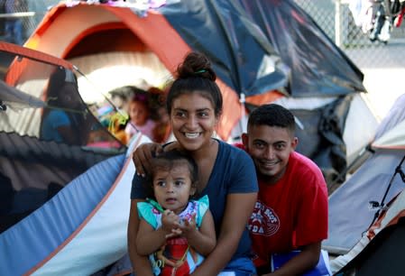 Honduran migrants Marvin Madrid and his new wife Dexy Maldonado speak during an interview with Reuters in an encampment in Matamoros