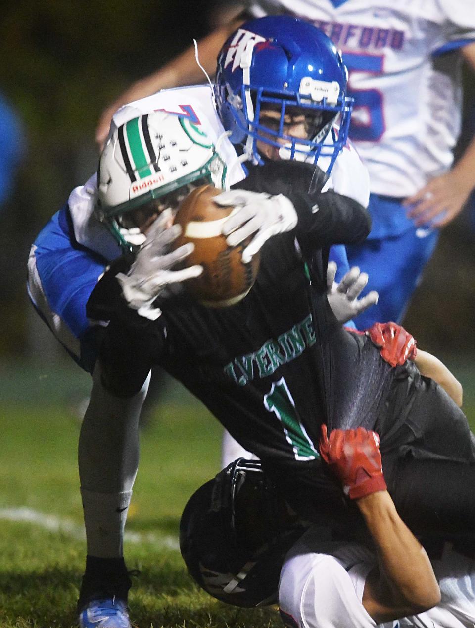 Griswold's KinKade Rubino tries to escape against Waterford earlier this season. Rubino scored three touchdowns in the Wolverines' 34-0 win against Plainfield on Thanksgiving Day.