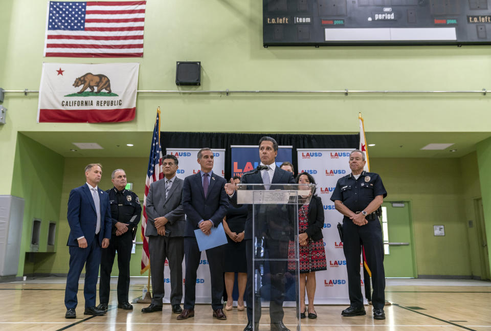 Alberto Carvalho, Superintendent, Los Angeles Unified School District, the nation's second-largest school district, at podium, comments on an external cyberattack on the LAUSD information systems during the Labor Day weekend, at a news conference at the Edward R. Roybal Learning Center in Los Angeles Tuesday, Sept. 6, 2022. Officials from left, FBI Assistant Director in Charge of the Los Angeles Field Office Donald Alway, LAUSD Chief of Police Steve Zipperman, Soheil Katal, LAUSD Chief Information Officer, Mayor of Los Angeles Eric Garcetti, Superintendent Carvalho, and LAPD Chief Michel Moore. (AP Photo/Damian Dovarganes)